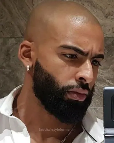 Clean shaven head with full beard