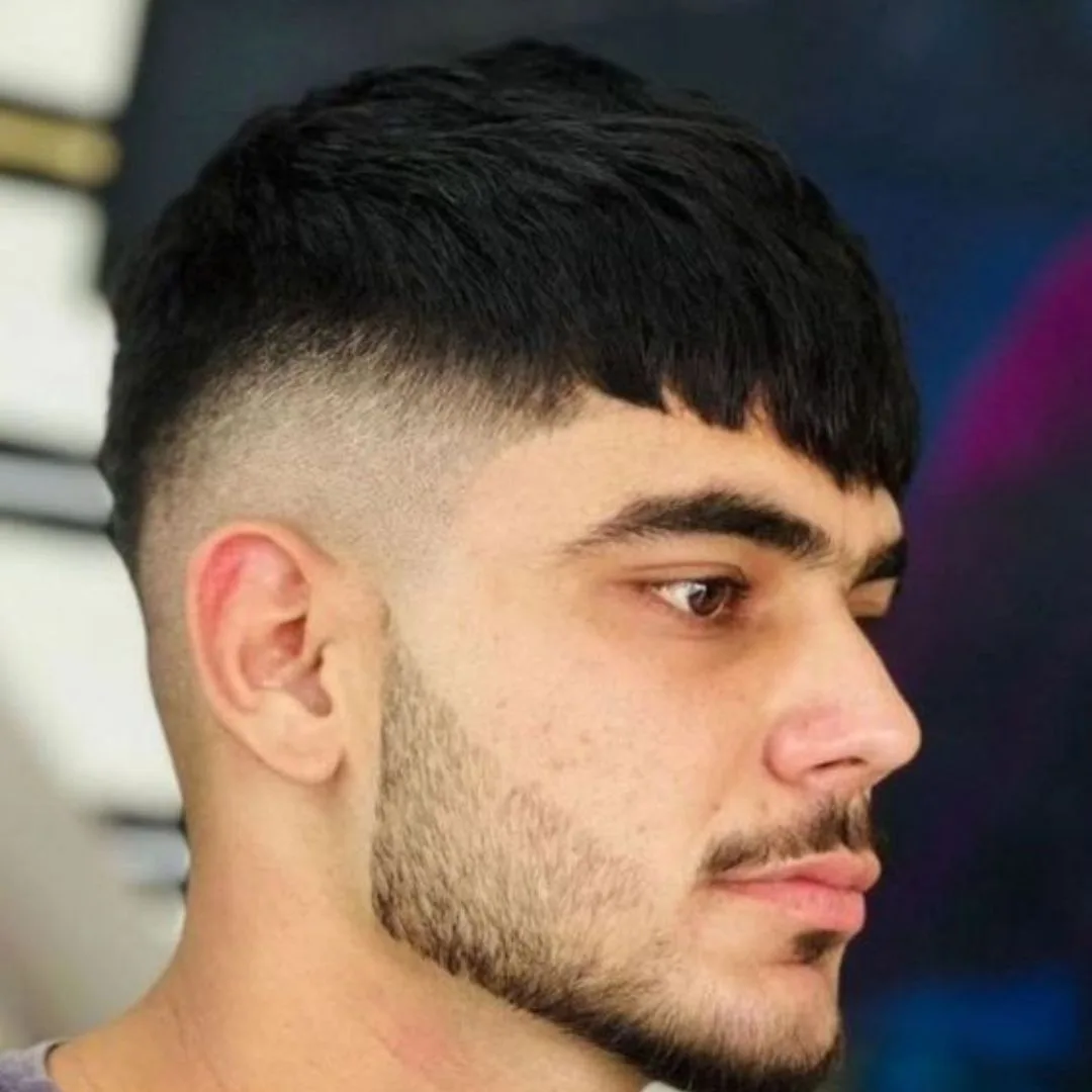 Men's undercut haircut and a short beard