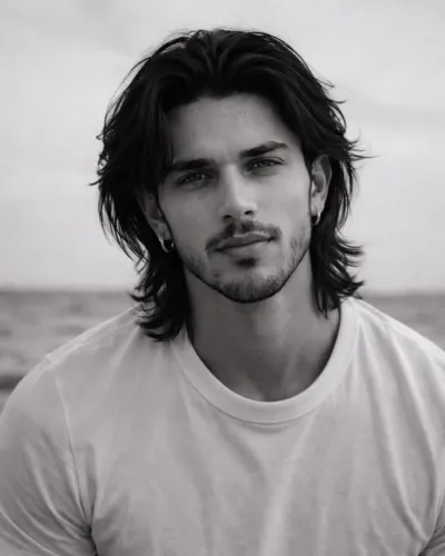 Best hairstyle for men to pair with a short beard featuring a clean drop fade