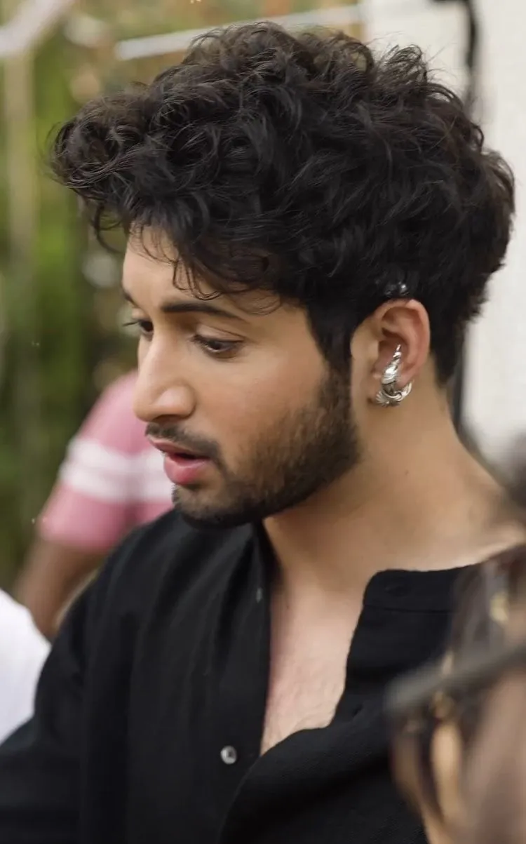 medium curly hairstyle for men