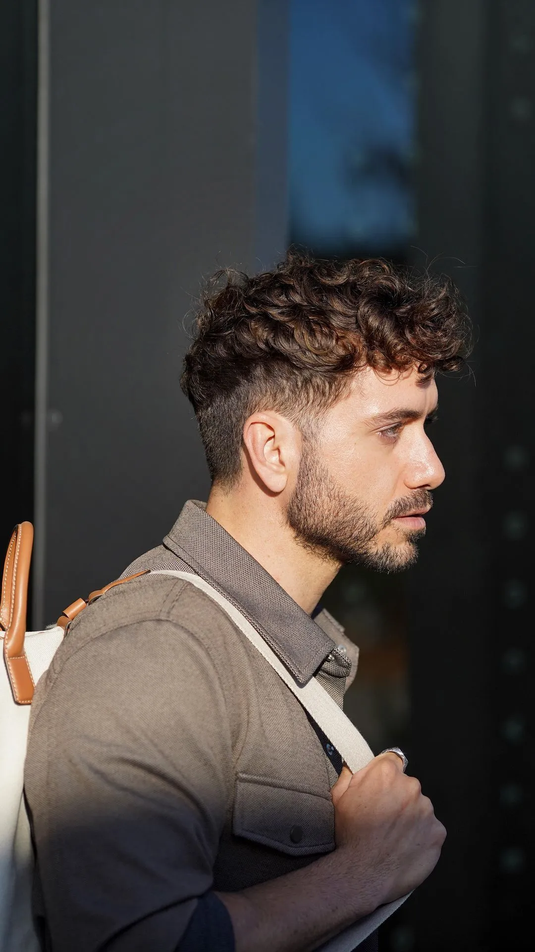 messy curly fade hairstyle for men