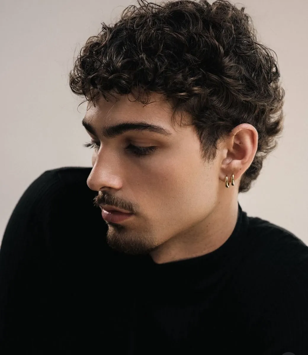 messy curly hair with fade for men