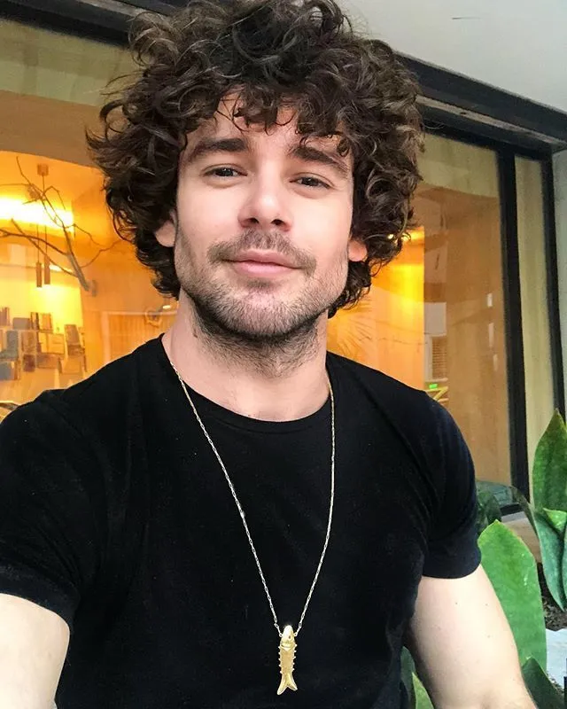 messy curly hair styled casual for men
