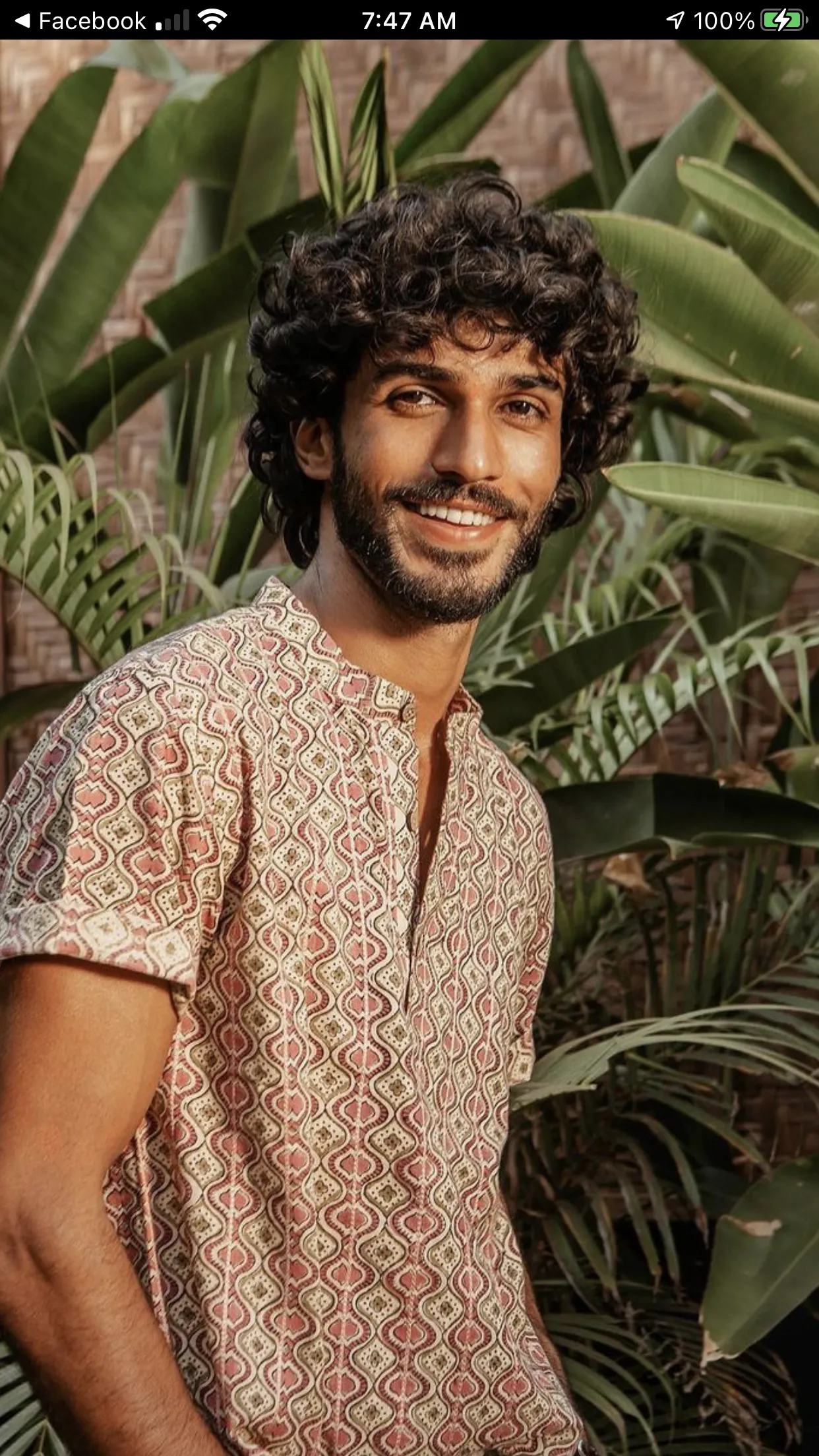 messy thick curly hairstyle for men