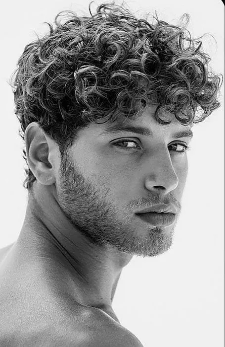 thick curly mullet with fade for men