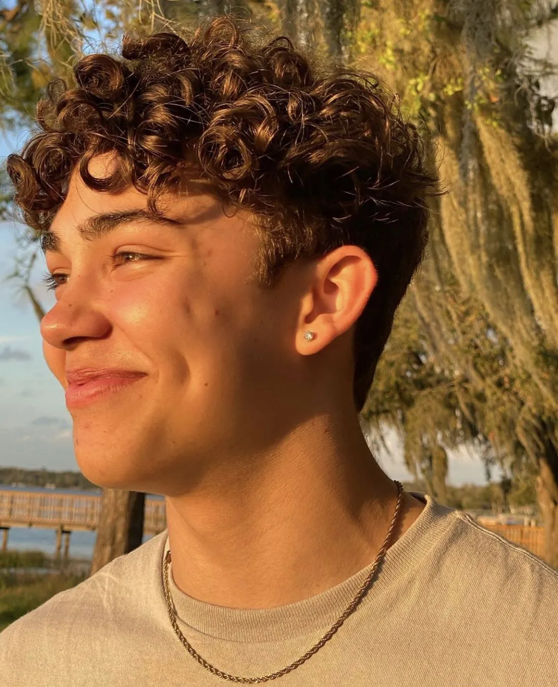 thick short curly hair fade profile for men